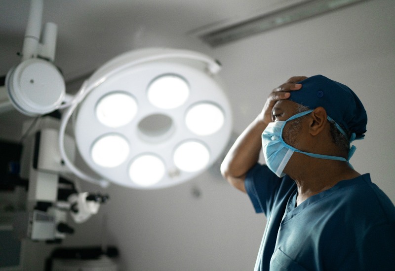 A surgeon in an operating room, representing stress after a surgical mistake in Las Vegas, NV