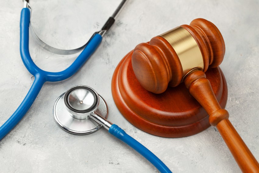 A judge's gavel and stethoscope representing a personal injury case